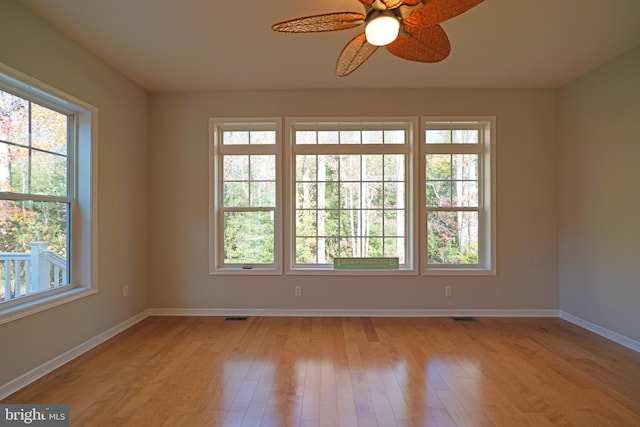 empty room featuring light hardwood / wood-style flooring and ceiling fan