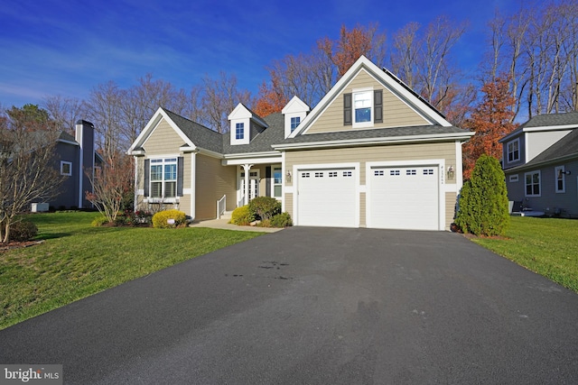 view of front facade featuring a front yard and a garage