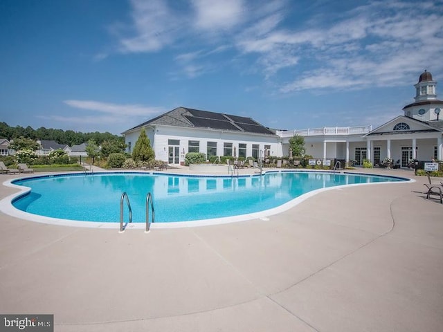 view of pool featuring a patio area