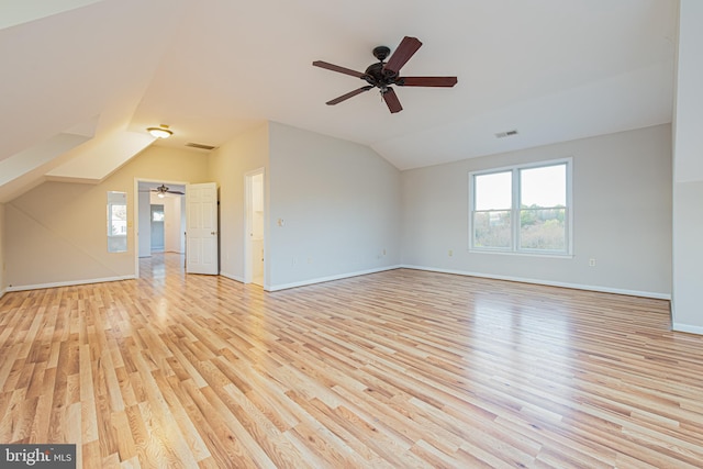 interior space with ceiling fan, lofted ceiling, and light hardwood / wood-style flooring