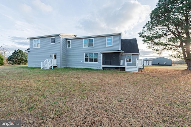 rear view of property with a yard