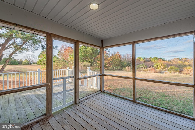 unfurnished sunroom featuring a wealth of natural light