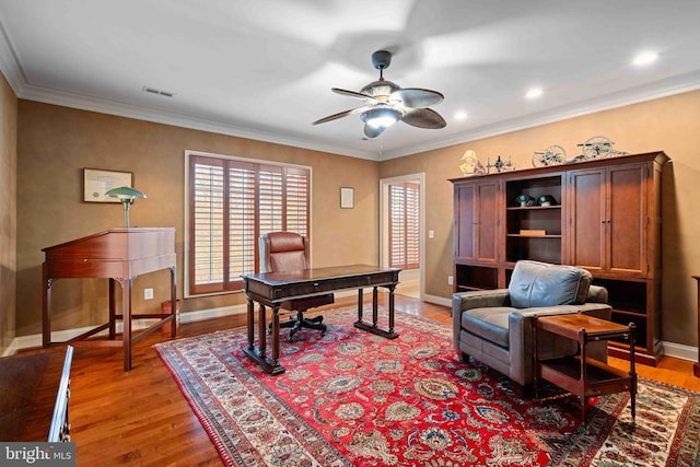 office with hardwood / wood-style floors, ceiling fan, and crown molding