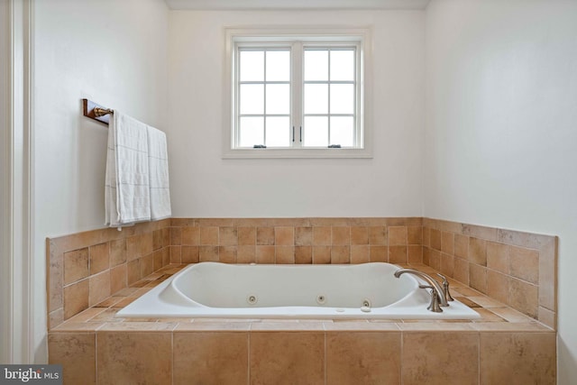 bathroom featuring tiled bath