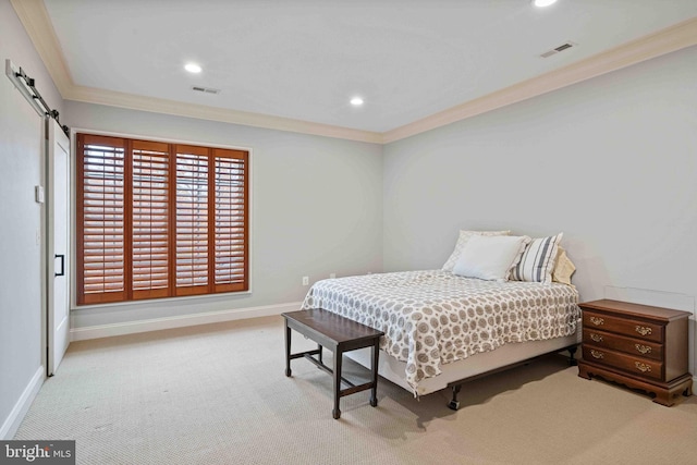 bedroom featuring light carpet, a barn door, and crown molding