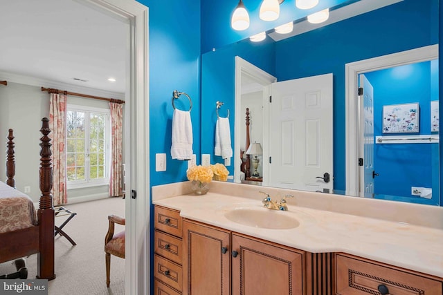 bathroom with vanity and crown molding