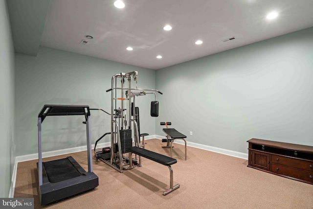 workout area with light colored carpet