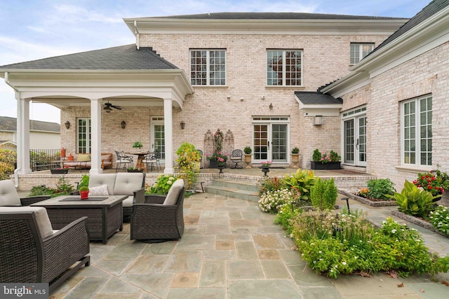 view of patio / terrace with ceiling fan and an outdoor living space