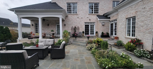 view of patio featuring an outdoor living space and ceiling fan