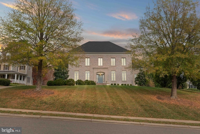 view of front of house with a yard