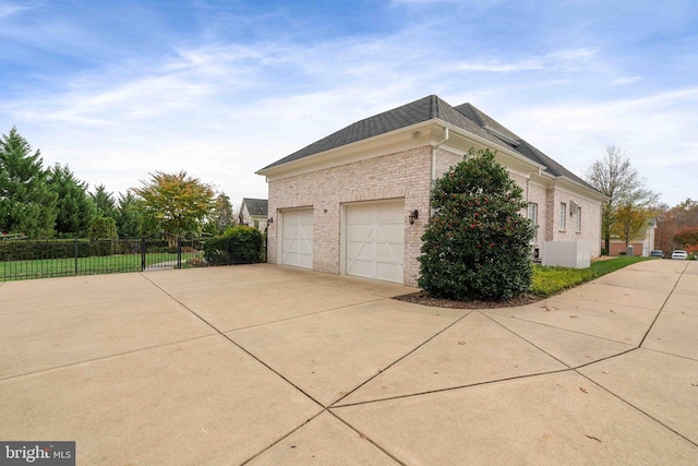 view of side of home with a garage