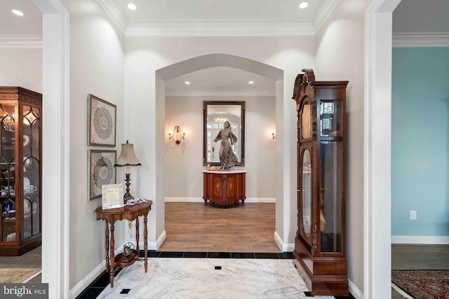 corridor with dark hardwood / wood-style flooring and crown molding