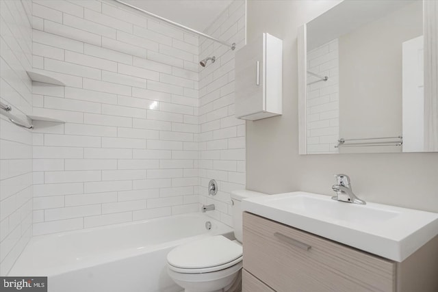 full bathroom with vanity, toilet, and tiled shower / bath