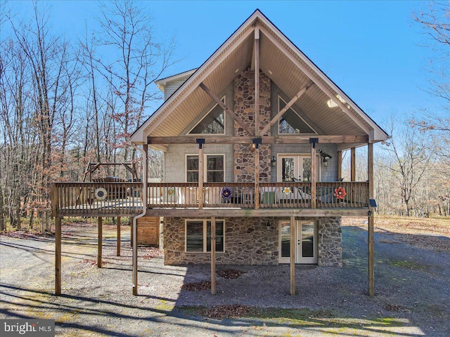 view of front of house featuring french doors and a deck