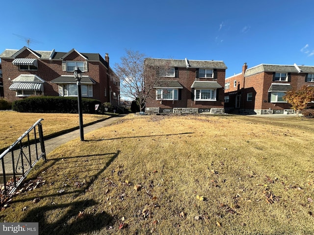 view of front of property featuring brick siding