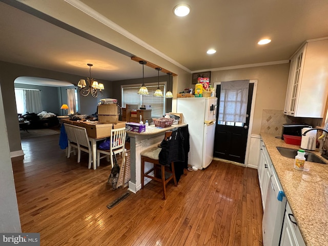 kitchen with sink, white cabinetry, dishwasher, and white fridge