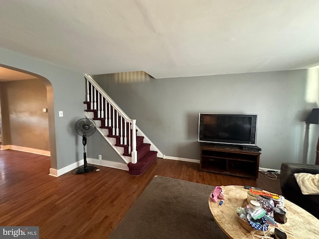 living room featuring dark wood-type flooring