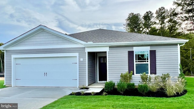 view of front facade featuring a garage and a front lawn