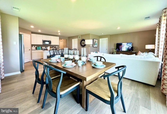 dining room featuring light hardwood / wood-style flooring