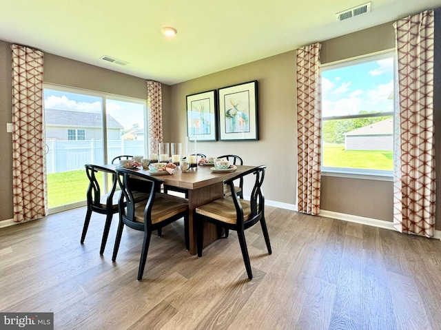 dining space featuring light hardwood / wood-style flooring