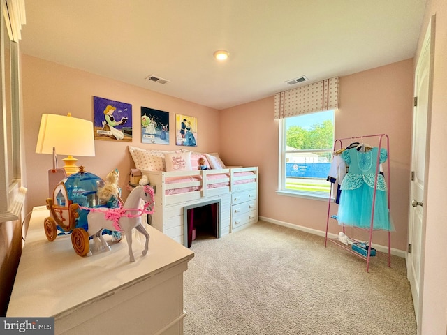 bedroom with light colored carpet