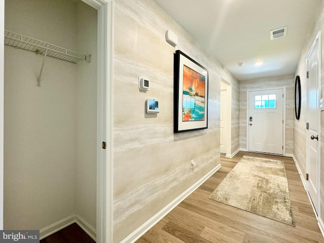 doorway with hardwood / wood-style floors