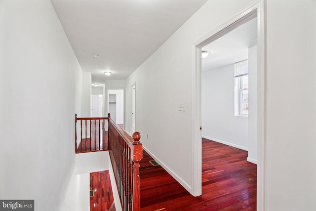 corridor featuring dark hardwood / wood-style flooring