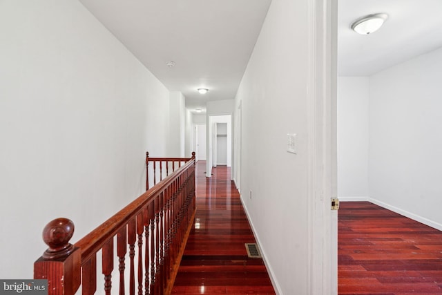 corridor with dark wood-type flooring