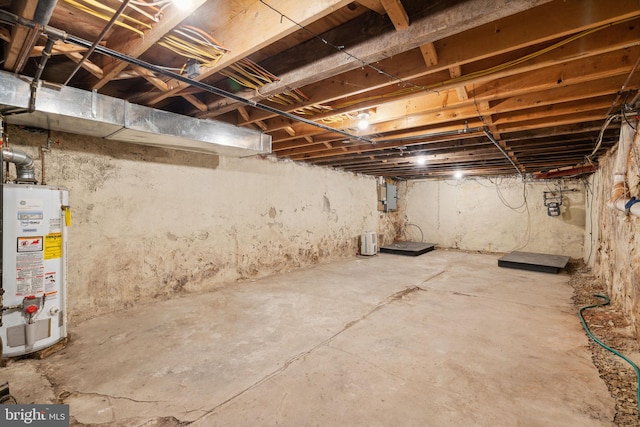 basement with electric panel and gas water heater