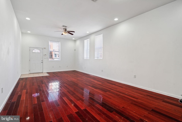 interior space with wood-type flooring and ceiling fan