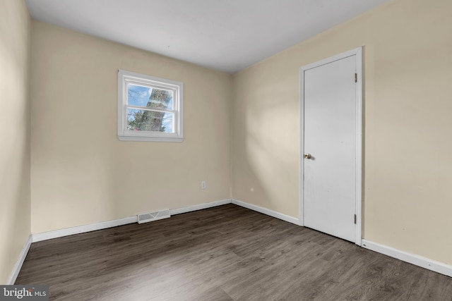 unfurnished room featuring wood-type flooring