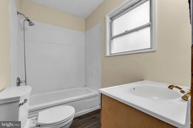 full bathroom featuring wood-type flooring, vanity, toilet, and shower / washtub combination