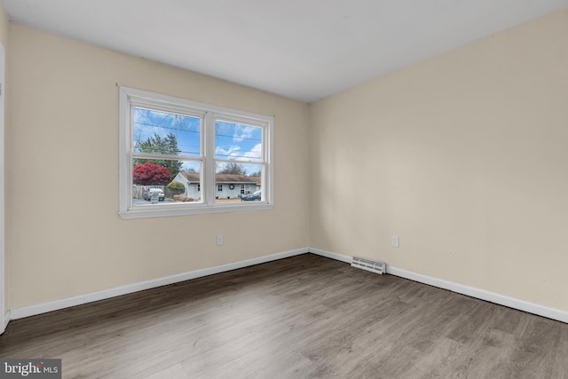 spare room featuring hardwood / wood-style floors