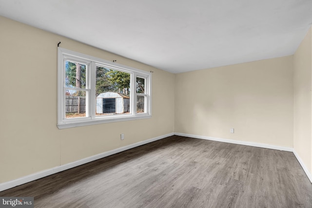 spare room with light hardwood / wood-style flooring