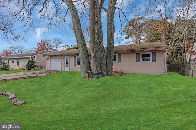 ranch-style house with a garage and a front yard