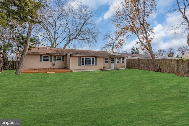 back of house with a yard