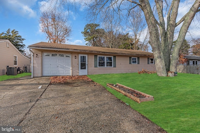 single story home featuring a garage, a front lawn, and central air condition unit