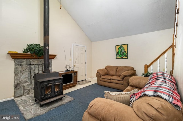 carpeted living room featuring high vaulted ceiling and a wood stove