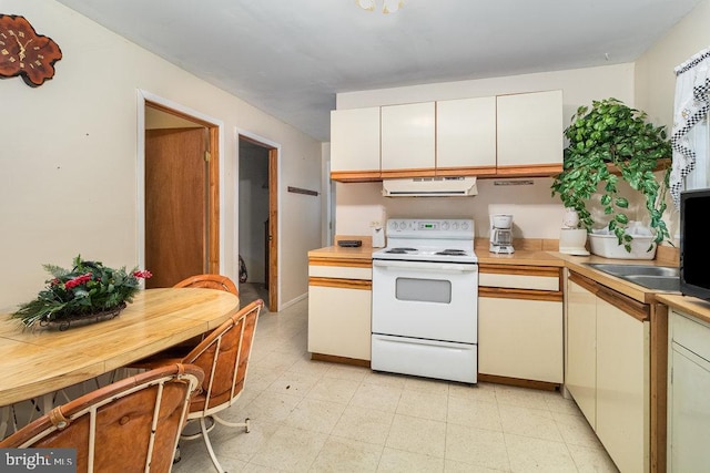 kitchen featuring electric range and extractor fan