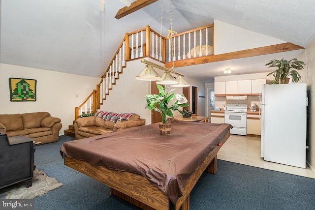playroom featuring light colored carpet, billiards table, high vaulted ceiling, and a wood stove