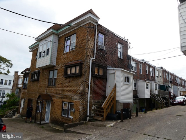 view of building exterior featuring cooling unit