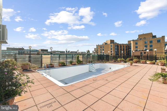 view of swimming pool with a patio area