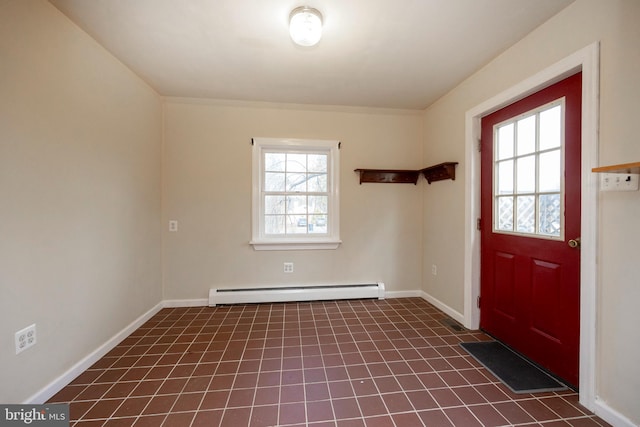 interior space featuring dark tile patterned floors and baseboard heating