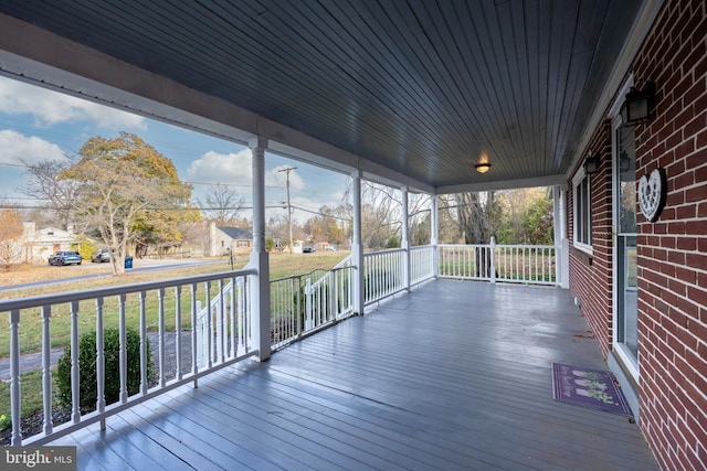 exterior space featuring a yard and covered porch