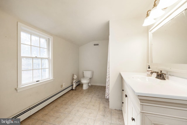 bathroom featuring toilet, vanity, lofted ceiling, and a baseboard heating unit