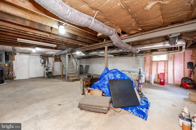 basement featuring electric panel