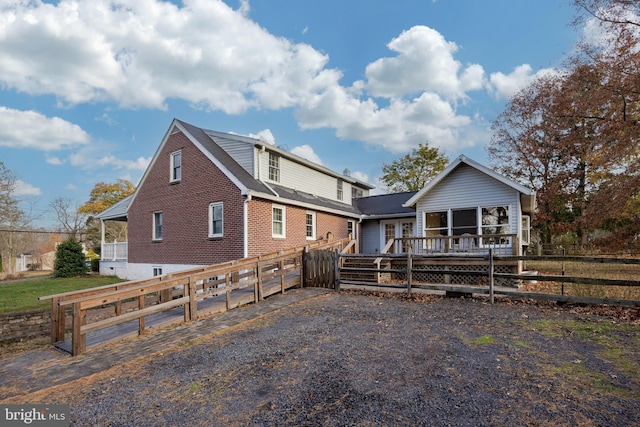 rear view of property with a deck