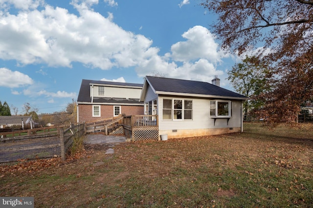 back of property featuring a deck