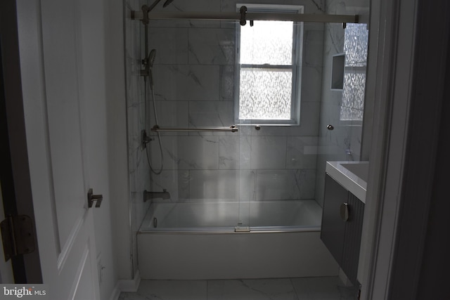 bathroom featuring vanity and enclosed tub / shower combo