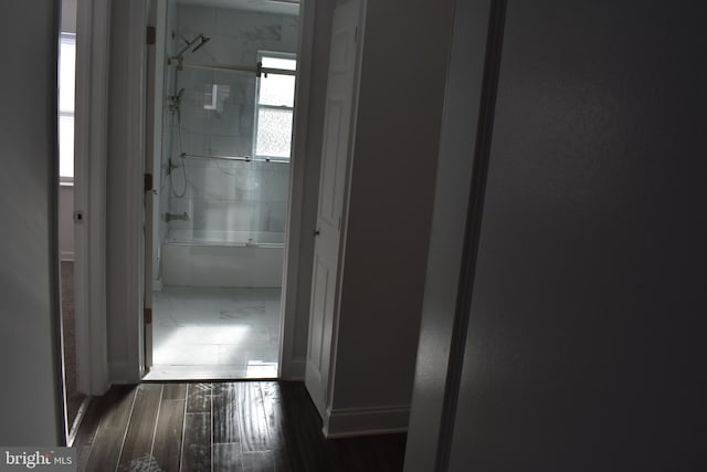 hallway with dark hardwood / wood-style floors